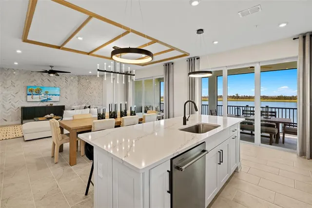 a bed room with a bed and a chandelier