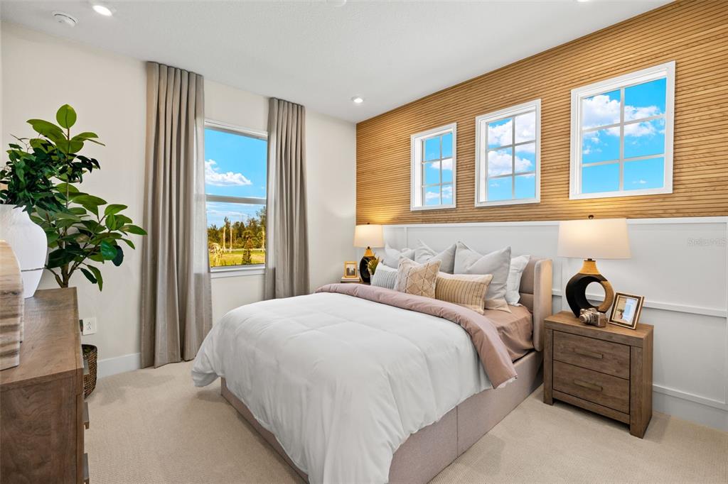 12785 Jade Empress Loop, Unit 202 Venice, FL 34293 - Photo 29 of 42 a bedroom with a bed and a window