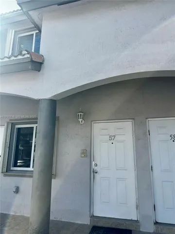 a hallway with cabinets