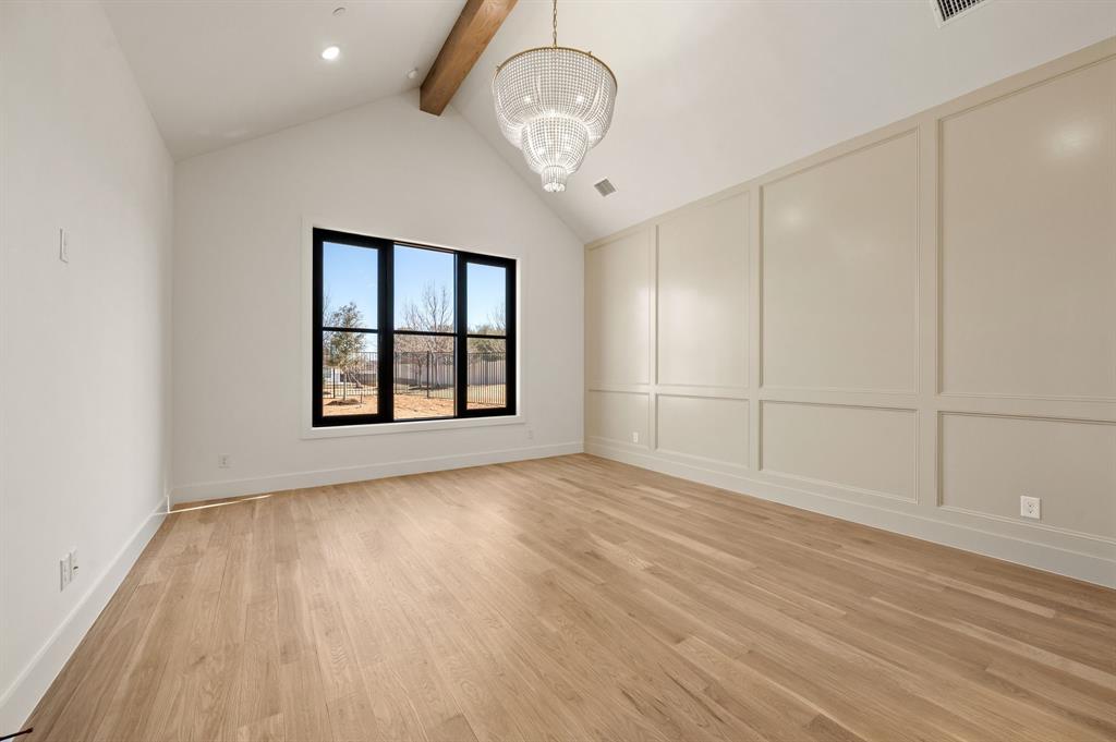1460 Copper Point Drive Prosper, TX 75078 - Photo 19 of 40 a view of empty room with wooden floor and fan