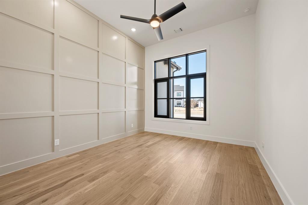 1460 Copper Point Drive Prosper, TX 75078 - Photo 26 of 40 wooden floor in an empty room with a window