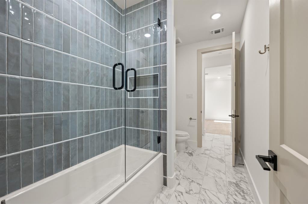 1460 Copper Point Drive Prosper, TX 75078 - Photo 31 of 40 a bathroom with a bathtub and shower