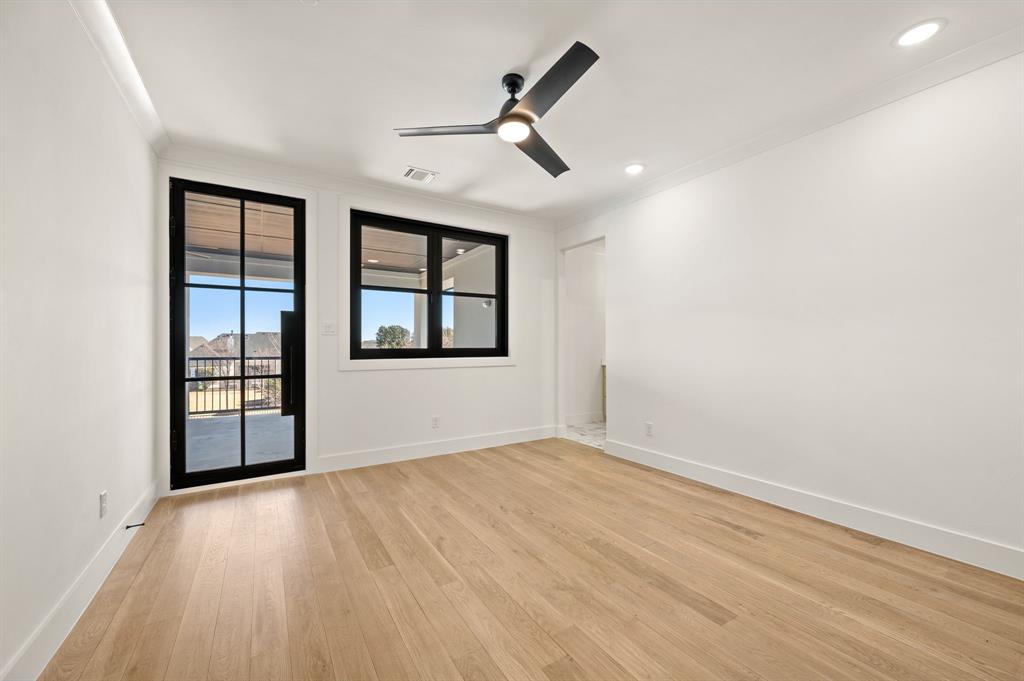 1460 Copper Point Drive Prosper, TX 75078 - Photo 32 of 40 wooden floor in an empty room with a window
