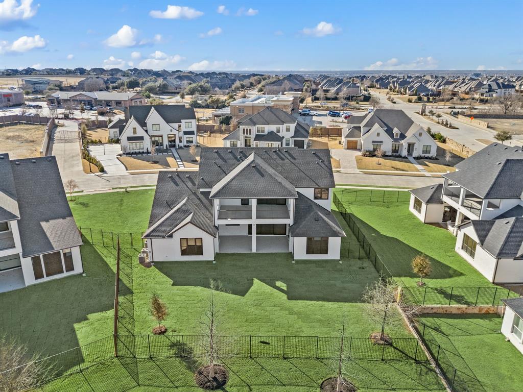 1460 Copper Point Drive Prosper, TX 75078 - Photo 40 of 40 an aerial view of a house with a yard