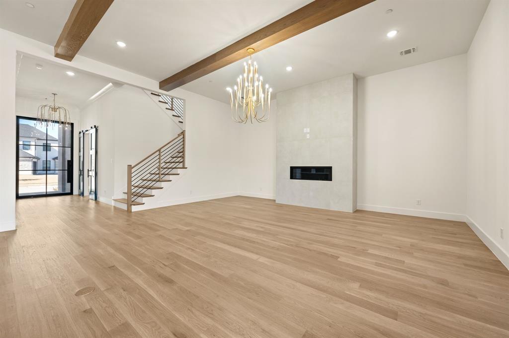 1460 Copper Point Drive Prosper, TX 75078 - Photo 8 of 40 a view of empty room with wooden floor