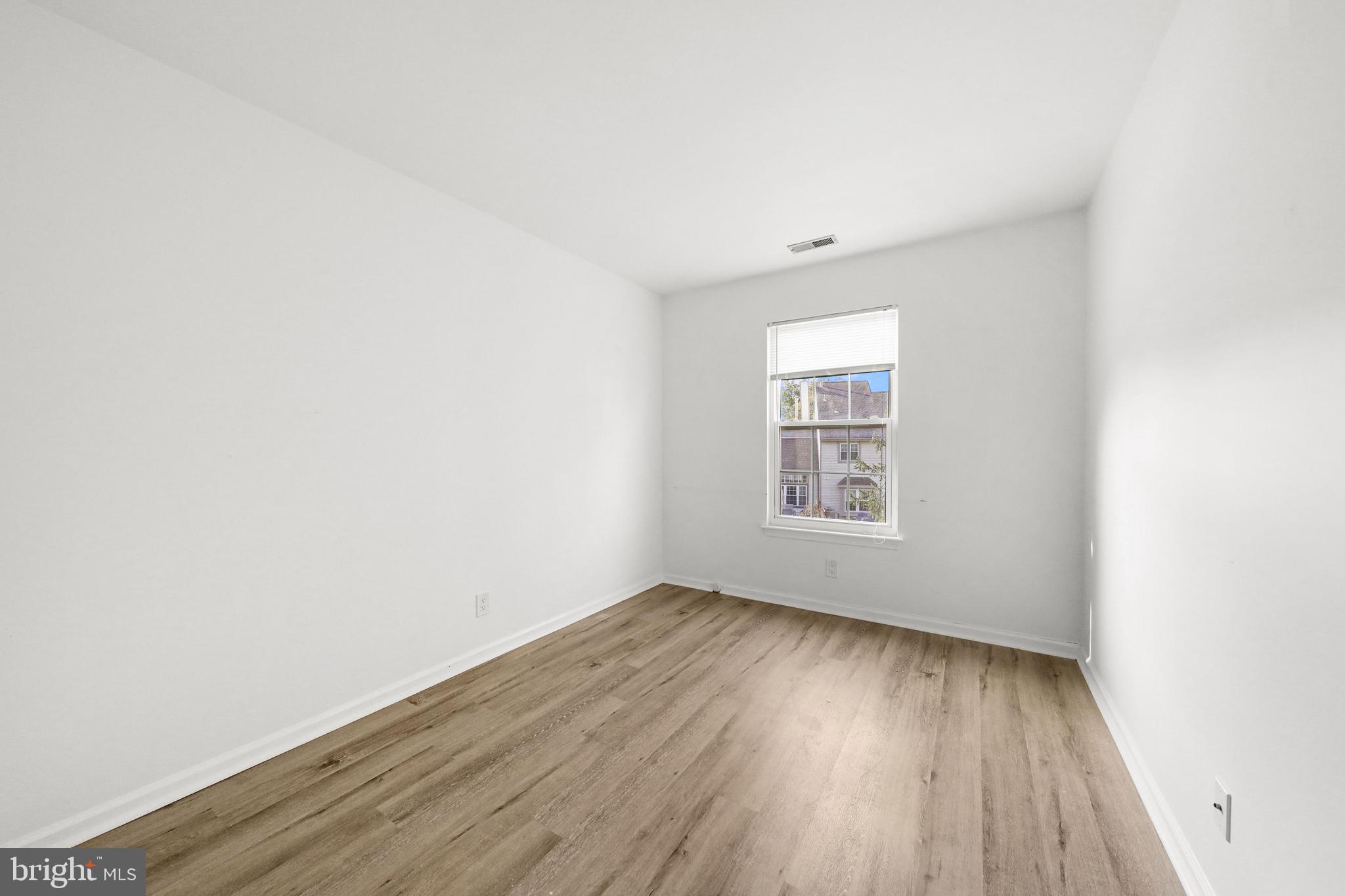 4204 Fenwick Lane Mount Laurel, NJ 08054 - Photo 16 of 27 an empty room with wooden floor and windows