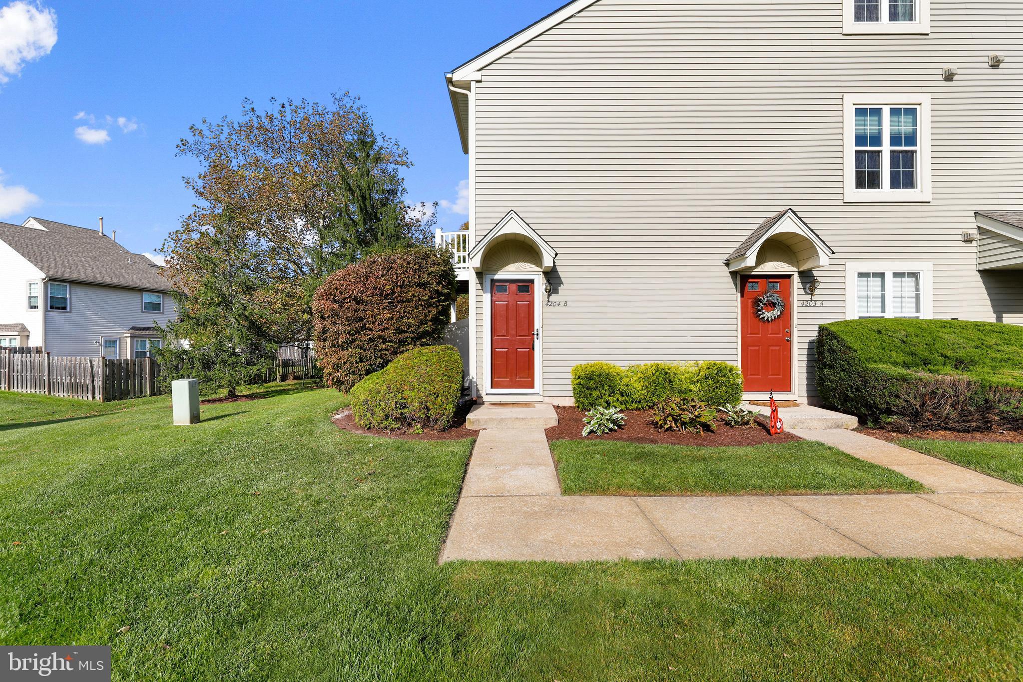 4204 Fenwick Lane Mount Laurel, NJ 08054 - Photo 2 of 27 a front view of house with yard and green space