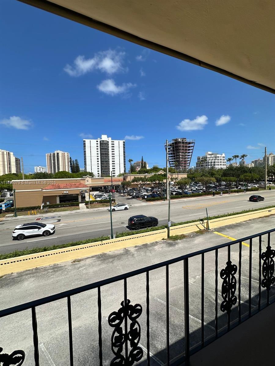 20201 Northeast 29th Court, Unit D335 Aventura, FL 33180 - Photo 12 of 12 a view of swimming pool with outdoor seating and city view