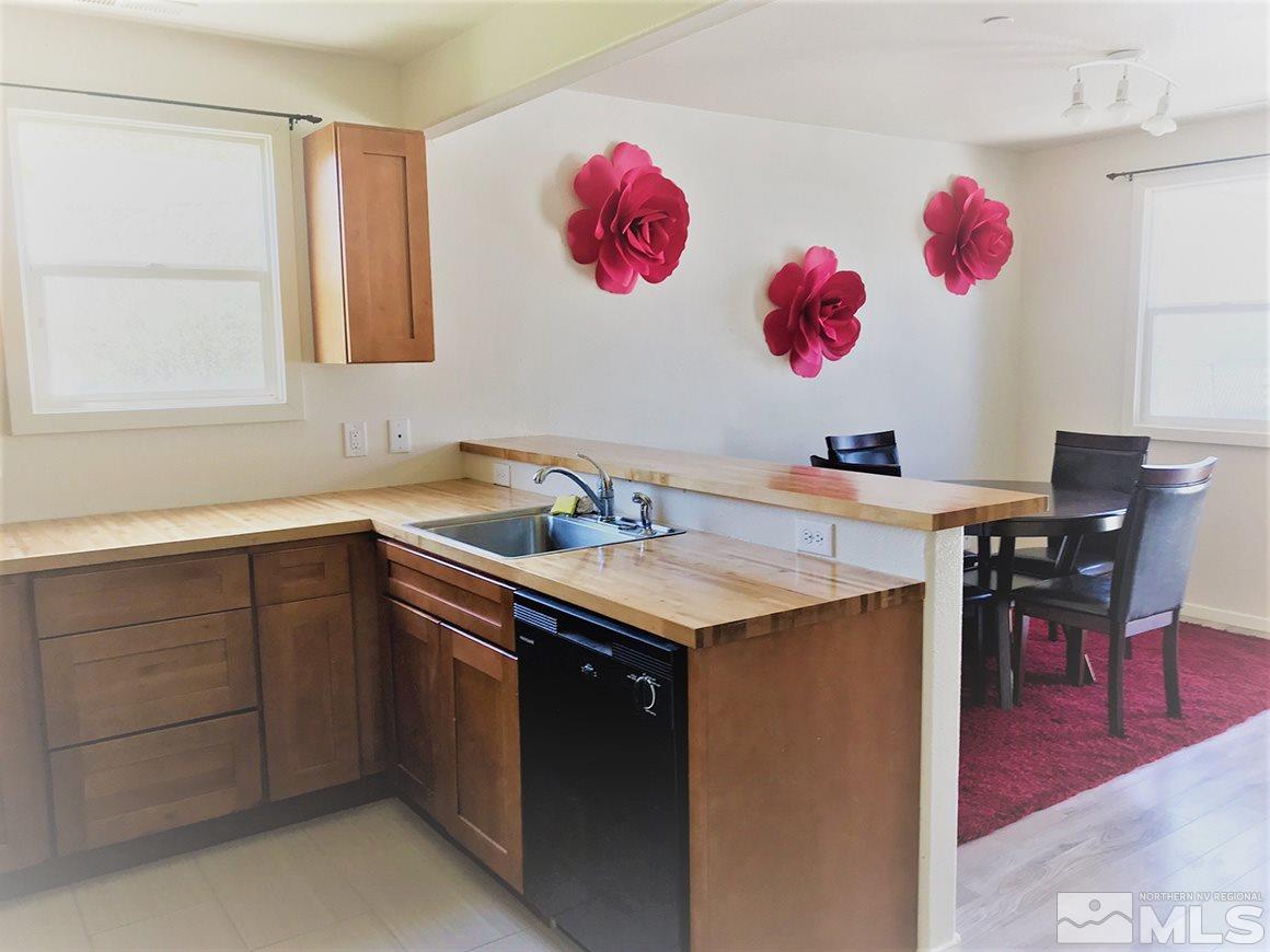237 East Arroyo Street Reno, NV 89502 - Photo 8 of 10 a kitchen with a sink cabinets and wooden floor