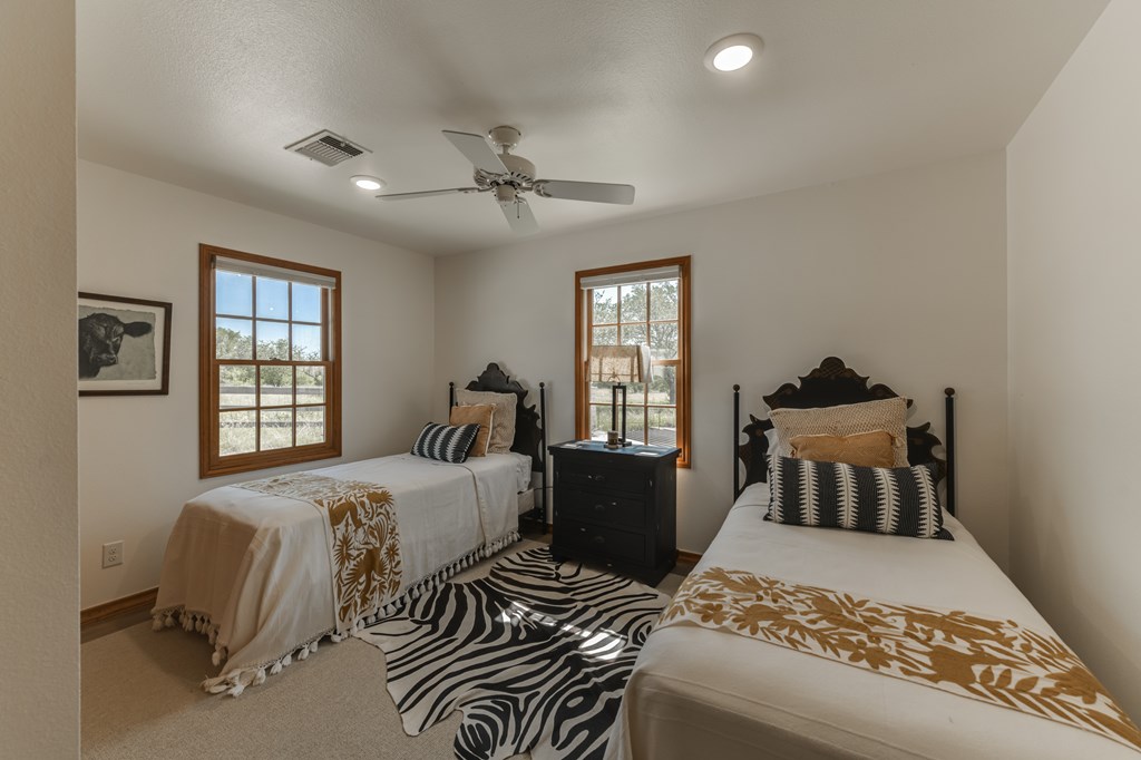 0 County Road Evant, TX 76525 - Photo 38 of 41 a bedroom with a bed and wooden floor