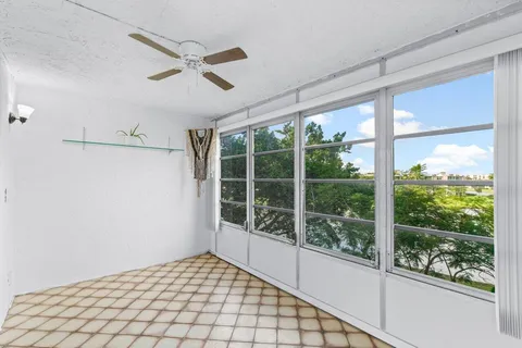 a view of a wooden deck with a yard