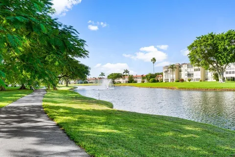 a view of a lake with houses in the back