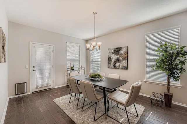 a dining room with furniture and window