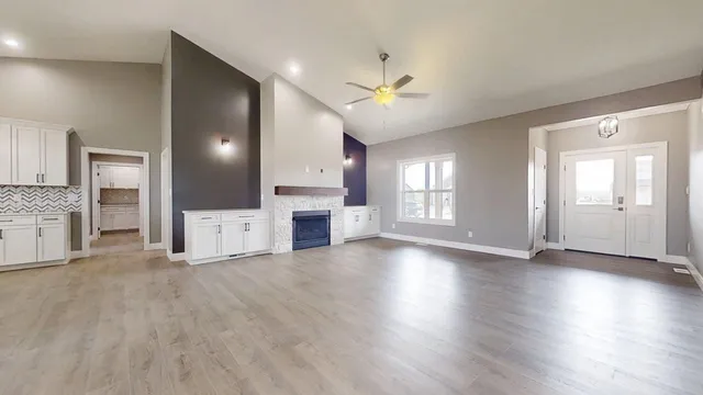 a view of a kitchen with a sink and a stove top oven