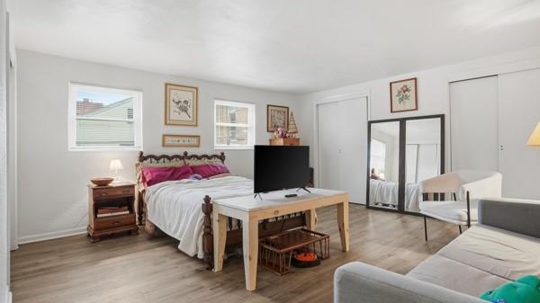 1311 Bingham Street Pittsburgh, PA 15203 - Photo 12 of 25 a bedroom with a bed and wooden floor