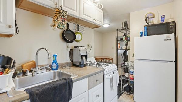 1311 Bingham Street Pittsburgh, PA 15203 - Photo 14 of 25 a kitchen with a refrigerator and a sink