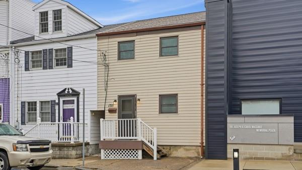 1311 Bingham Street Pittsburgh, PA 15203 - Photo 2 of 25 a view of a house with a door and wooden fence