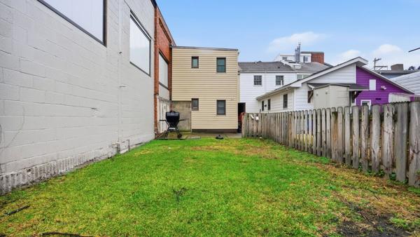 1311 Bingham Street Pittsburgh, PA 15203 - Photo 23 of 25 a view of backyard of house with wooden deck and furniture
