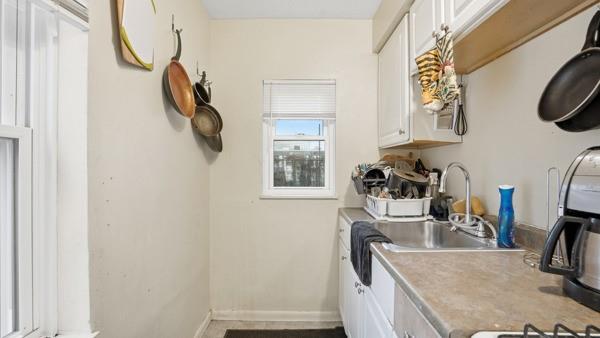 1311 Bingham Street Pittsburgh, PA 15203 - Photo 6 of 25 a bathroom with a sink and a mirror