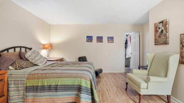 1311 Bingham Street Pittsburgh, PA 15203 - Photo 10 of 25 a bedroom with a bed and a chair