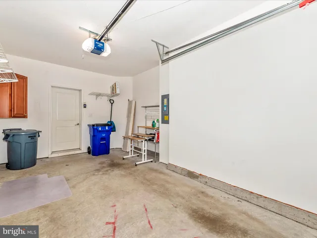 a living room with pool table and a ceiling fan