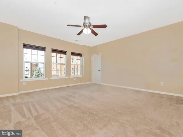 a bathroom with a granite countertop sink a mirror and a shower