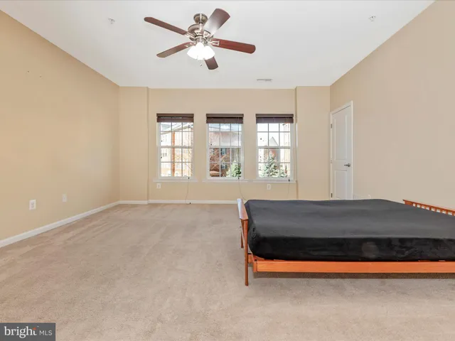 a bathroom with a granite countertop sink a toilet and bathtub
