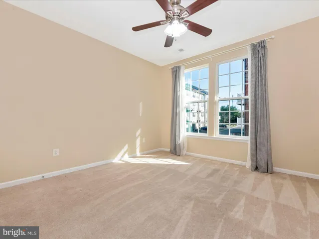 a view of a balcony with wooden floor and fence