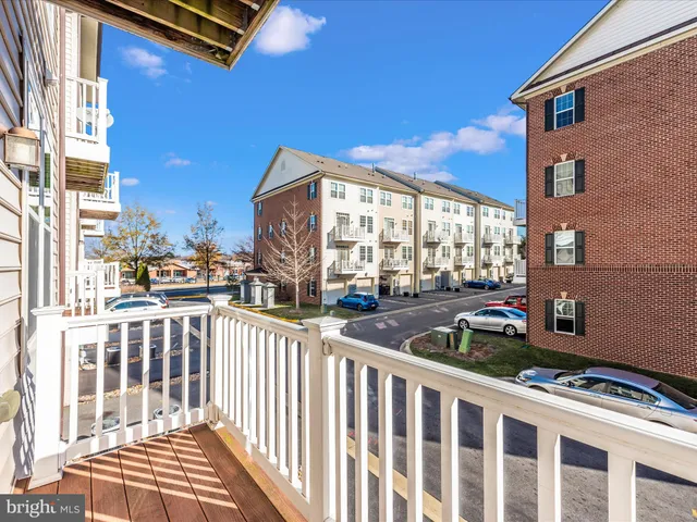 a park view with a bench and lawn chairs