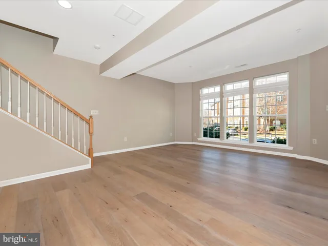 a kitchen with stainless steel appliances kitchen island granite countertop a stove a sink and a refrigerator