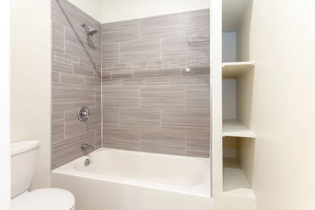 a bathroom with a shower and bathtub