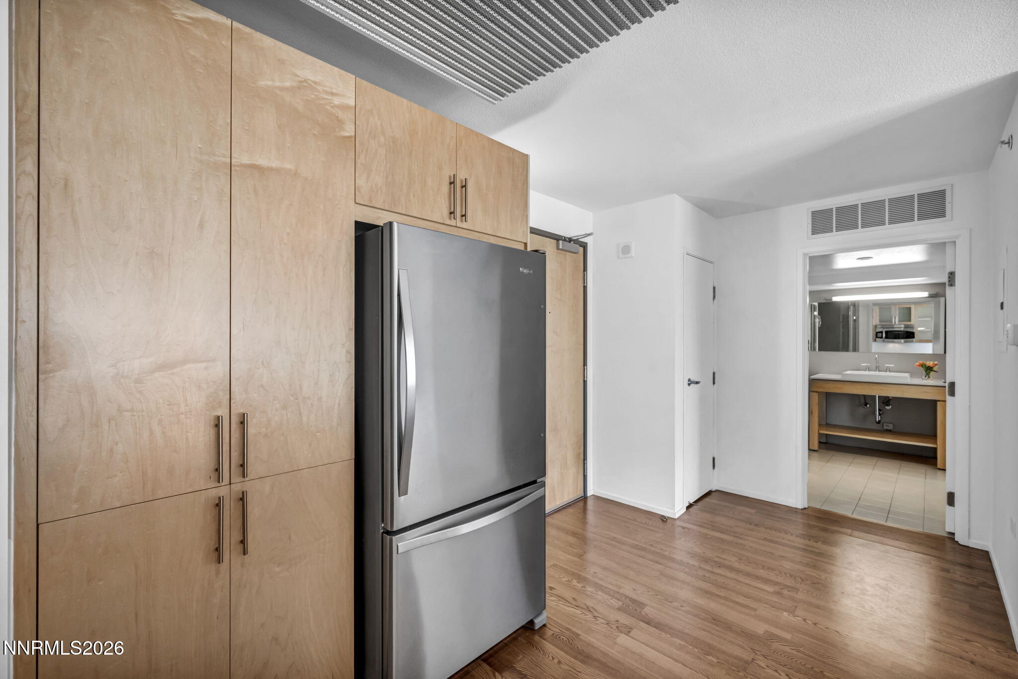 255 North Sierra Street, Unit 1208 Reno, NV 89501 - Photo 12 of 37 a kitchen with stainless steel appliances a refrigerator and a stove