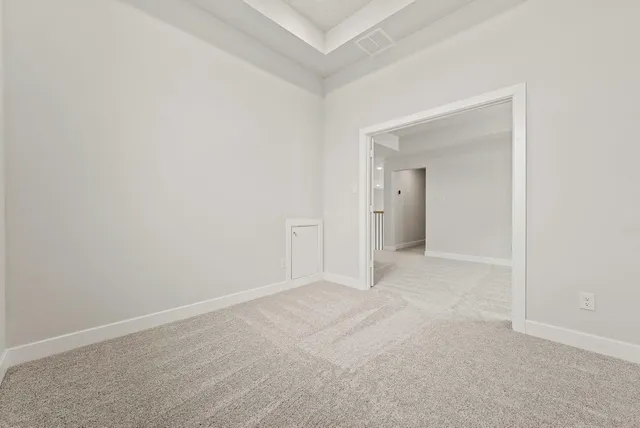 a view of an empty room and closet