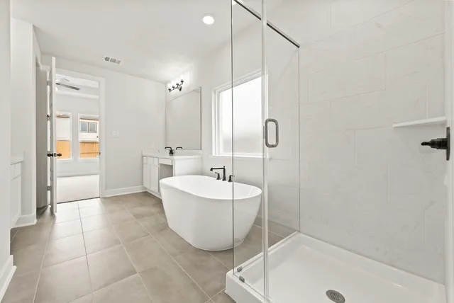 a bathroom with a sink a mirror and a bathtub