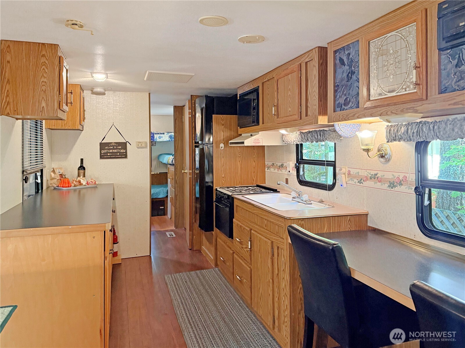 165-4 Christmas Tree Circle Maple Falls, WA 98266 - Photo 6 of 36 a kitchen with a refrigerator a stove top oven a sink and cabinets