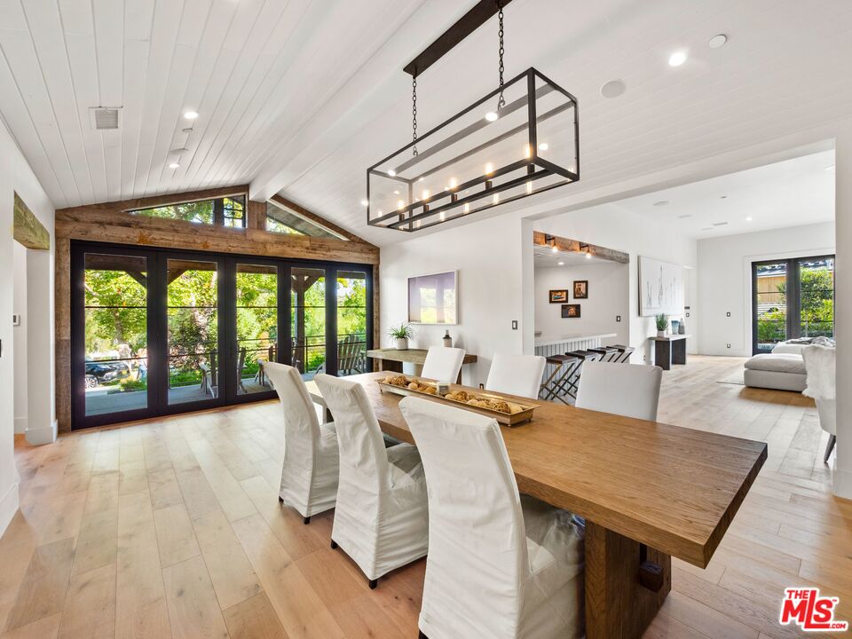 5207 Round Meadow Road Hidden Hills, CA 91302 - Photo 5 of 50 a view of a dining room with furniture window and wooden floor