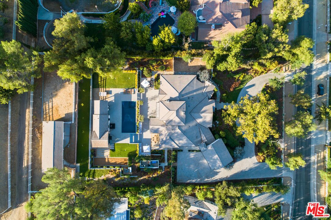 5207 Round Meadow Road Hidden Hills, CA 91302 - Photo 50 of 50 a view of a house with a yard and garden