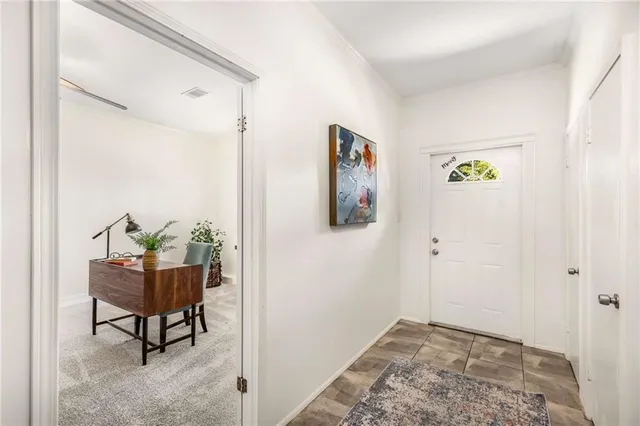 a view of room with window and furniture