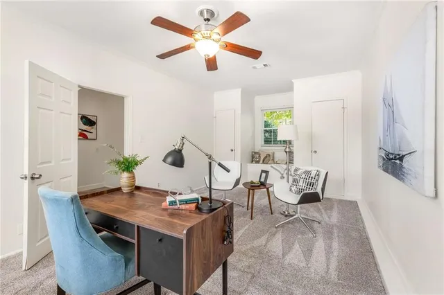 a view of a workspace with furniture