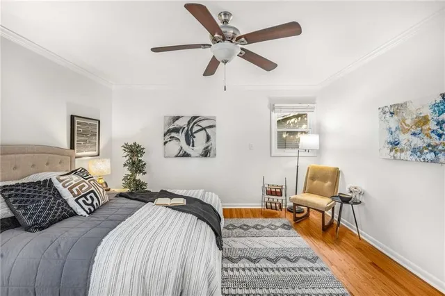 a bedroom with a bed and a chair