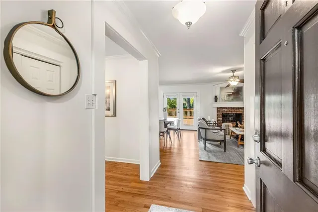 a view of a livingroom with furniture and a mirror