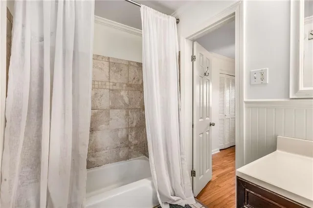 a bathroom with a bathtub and shower