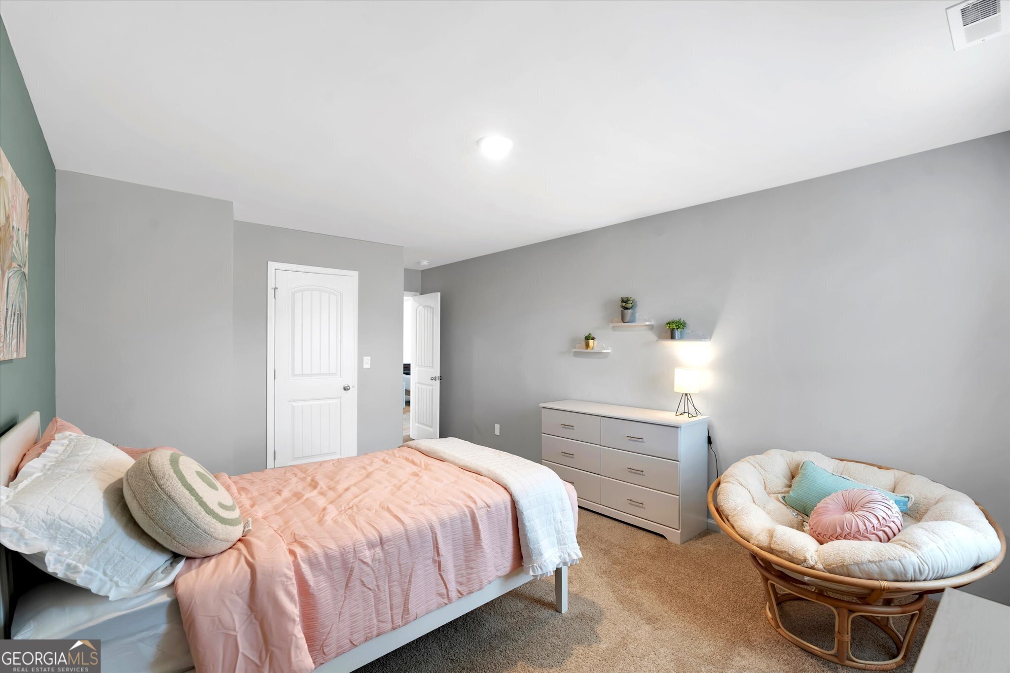 250 Rusty Plow Lane, Unit 25 Perry, GA 31069 - Photo 16 of 25 a bedroom with a bed and a chair