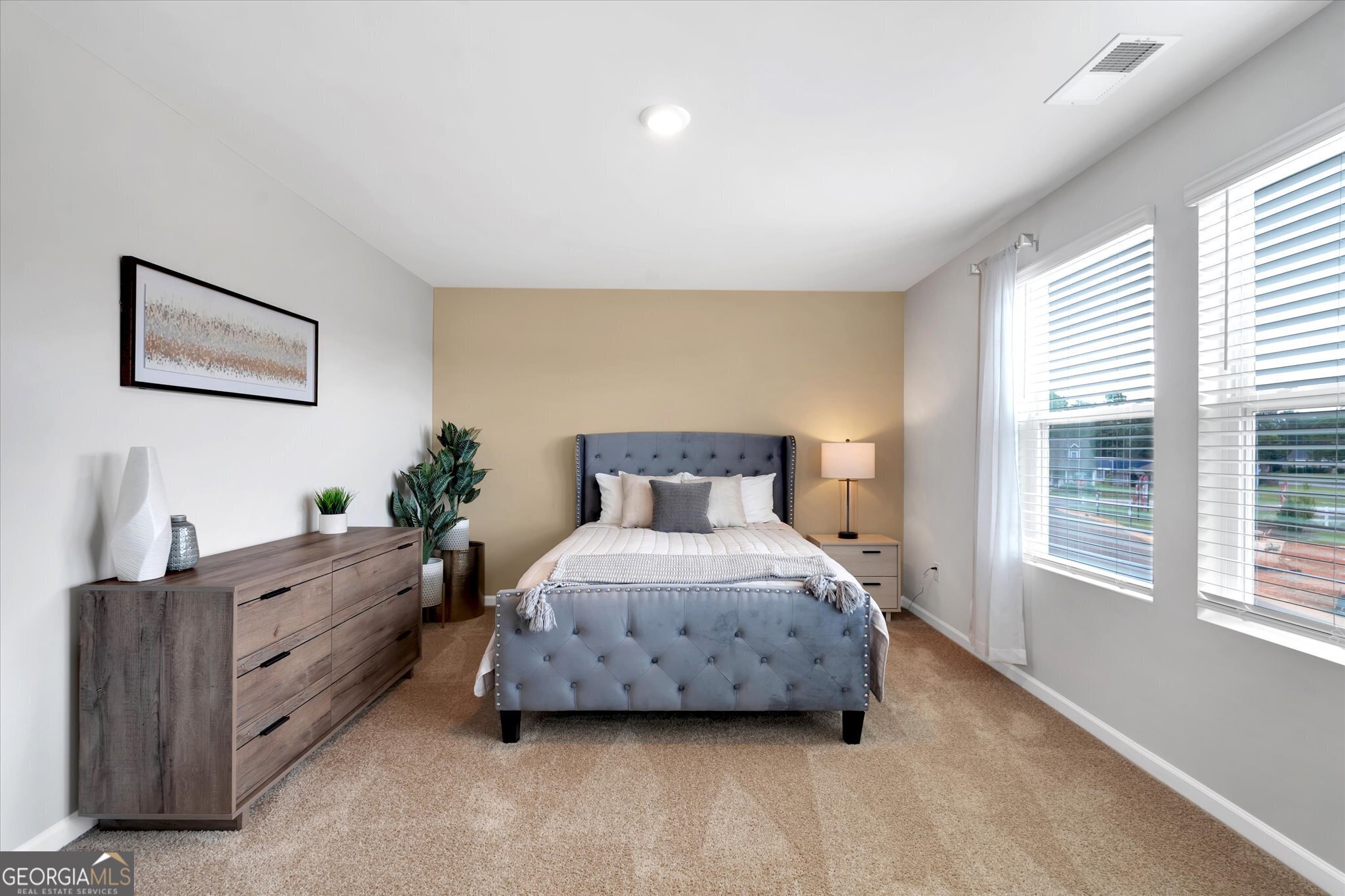 250 Rusty Plow Lane, Unit 25 Perry, GA 31069 - Photo 22 of 25 a spacious bedroom with a bed and a window