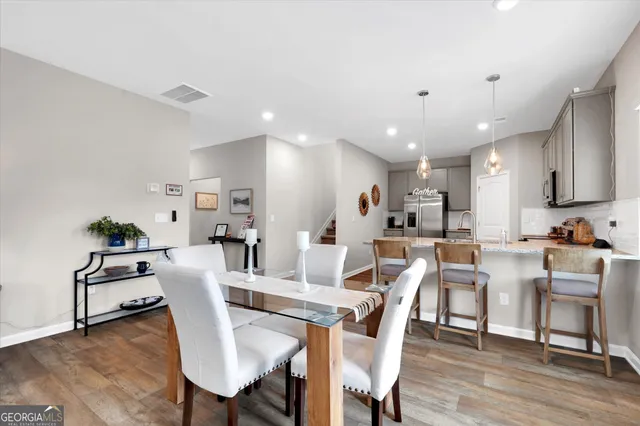 a view of a dining room with furniture