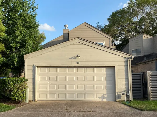a white house with a outdoor space