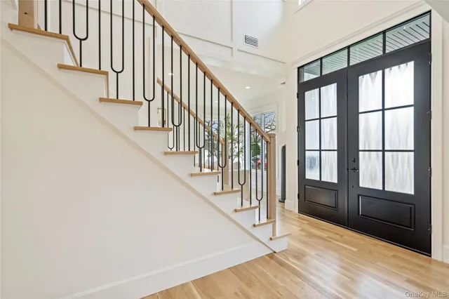a view of an entryway with wooden floor