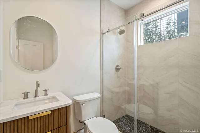a kitchen with a sink a counter top space appliances and cabinets