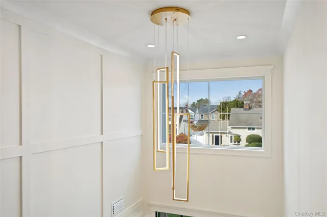 a view of staircase with white walls