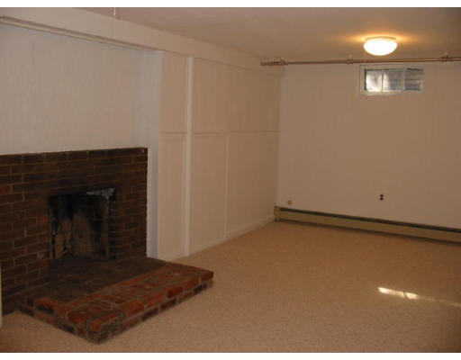 16 Grosvenor Road Needham, MA 02492 - Photo 7 of 7 a view of a hallway with a fireplace